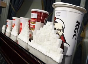 New York Mayor Michael Bloomberg is proposing a ban on the sale of large sodas and other sugary drinks in the city's restaurants, delis and movie theaters in the hopes of combating obesity.