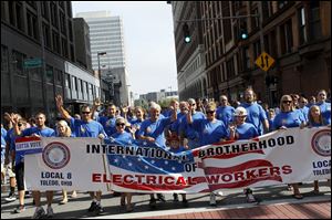  Members of the International Brotherhood of Electrical Workers Local 8 march during the Toledo Labor Day Parade. Members from more than 40 local unions participated.