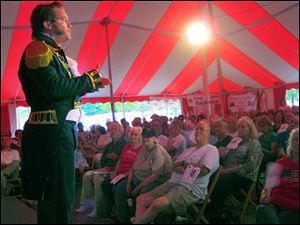 Jeremy Meier, who teaches theater at Owens Community College, performs as Oliver Hazard Perry during a chautauqua in a large striped tent. His performance will be part of the 2013 chautauqua.