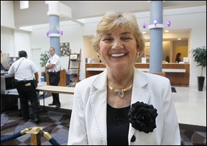 Toledo Hilton owner Grace Chojnowski-Kellogg, shown in the hotel lobby, says having President Obama stay at her hotel is a dream come true. The Polish immigrant said she will now call the suite in which Mr. Obama stayed the 'Obama Presidential Suite.'