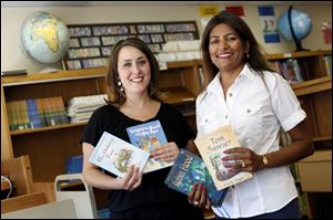 Missy Madigan, left, president of the Toth Parents' Club, and Sherina Ohanian, Perrysburg Elementary Parents' Association president, express their thanks for the boost provided by the fund-raiser. 