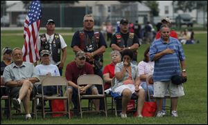 Residents join in the tribute to veterans and service personnel
during the Support the Troops Rally. Wednesday’s event was sponsored by Heroes in Action, the Point Place Business Association, and the Friendship Park Community Center.