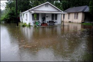 Water surrounds homes in Selma., Ala., which sits along the Alabama River. The National Weather Service said streets were flooded 3 feet deep on Tuesday.