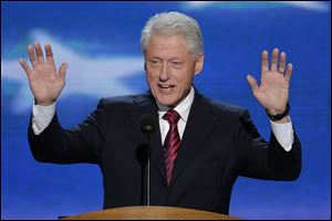 Bill Clinton greets the audience at the Democratic National Convention. His presence Wednesday was in sharp contrast to the absence of former President George W. Bush at the Republican convention a week earlier.
