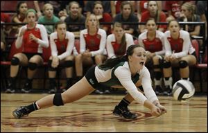 Central Catholic's Kaitlin Bronikowski dives to save a ball during the Irish's 25-13, 28-26, 25-19 loss to St. Ursula, which returned just four players this season.