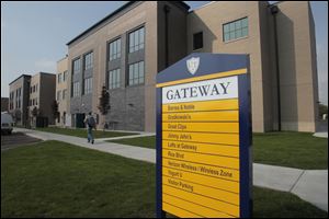 The University of Toledo celebrated the opening of the Gateway project, which features a variety of businesses adjacent to the university at Dorr and Secor Avenues in Toledo. About 100 people listened to remarks from University of Toledo officials, students scurried along the sidewalks and muscular runners zipped by the two-story, 18,000-square-foot Barnes & Noble Booksellers anchors the facility, which is home to a variety of shops and services.