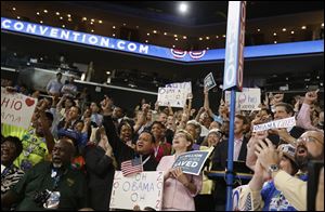 Delegates applaud ahead of Vice President Joe Biden and President Obama's speeches. Some of the biggest cheers came when Mr. Biden said ‘Osama bin Laden is dead and General Motors is alive.'