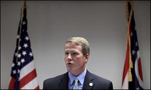 Ohio Secretary of State Jon Husted conducts a press conference August 15, 2012 to address statewide standards for early voting hours.