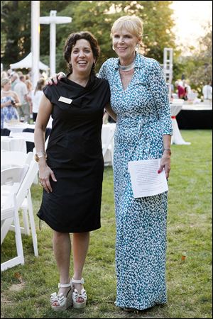 Art & Autism Chair Rita Mansour, left, and host Barbara Steele pose for a photograph at the benefit event For Art and Autism.
