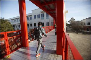A bridge painted the same color as the Golden Gate Bridge in San Francisco connects some of the buildings on the new campus Facebook is constructing for its employees near Menlo Park, Calif.