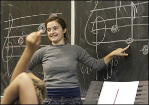 Instructor Meaghan Roberts teaches her be instrumental music class at the Friendly Center.