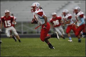 Marlino Menchaca of Bowsher runs the ball during the first quarter against Bowling Green.