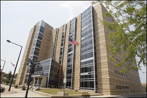 The seven-story, $38 million justice center that opened across the street in 2004 prompted the move of courts out of the old courthouse that year.
