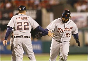 Detroit Tigers' Prince Fielder, right, celebrates his home run with third base coach Gene Lamont during the second inning Friday night.