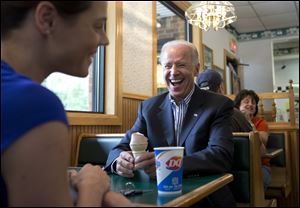 Vice President Joe Biden talks with Lisa McIntosh during a discussion over ice cream at a Dairy Queen in Nelsonville, in southeast Ohio. He is to be in Portsmouth and Milford, Ohio, today.