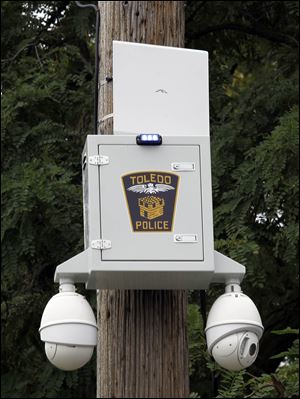A Toledo police security camera pod at Locus and Ontario streets is a typical installation.