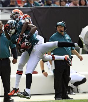 Eagles defensive back Dominique Rodgers-Cromartie (23) intercepts the ball intended for Browns wide receiver Travis Benjamin (80) in the second quarter on Sunday in Cleveland.