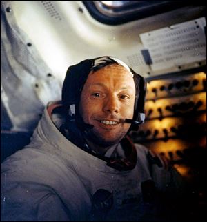 This July 20, 1969, file photo shows Neil Armstrong on the first voyage to land on the moon.