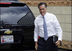 Candidate Mitt Romney arrives at his campaign offices in Boston Sunday to prepare for a debate.