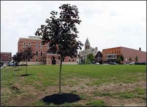 Seneca County's 1884 courthouse site sits barren. Commissioners voted 2-1 to pay $408,000 to raze the historic building earlier this year rather than restore it, a task that would have cost $8 million and involved a low-interest federal loan and the sale of bonds. The county still needs space for juvenile and probate courts and still has no plan.