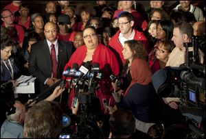 Chicago Teachers Union President Karen Lewis informs reporters at a news conference outside the union's headquarters in Chicago that the city's 25,000 public school teachers will walk the picket line Monday morning after talks with the Chicago Board of Education broke down Sunday evening.