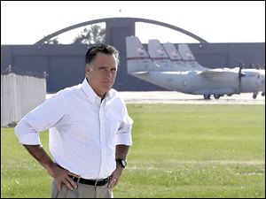Republican presidential candidate Mitt Romney pauses today after looking at C-27J transport  planes at the airport in Mansfield, Ohio. 