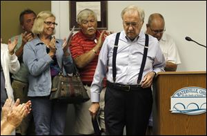 Waterville resident Jim Perry is applauded after stating his opposition to the Kensington Garden development during Waterville city council meeting in Waterville, Ohio.