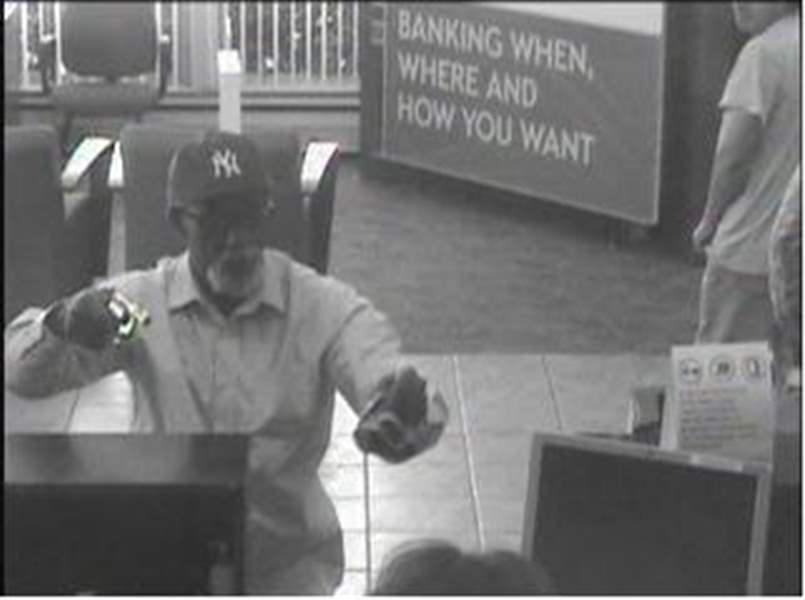 Surveillance-photo-of-armed-robbery