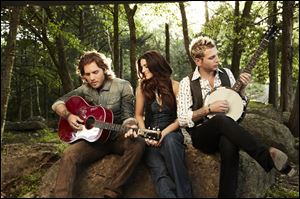 From left, Tom Gossin, Rachel Reinert, and Mike Gossin of the country trio, Gloriana.