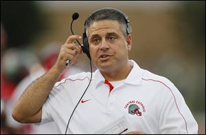 Toledo Central Catholic head coach Greg Dempsey roams the sidelines earlier this year.