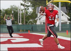 Toledo Central Catholic player Derich Weiland finds the end zone for a touchdown earlier this season.