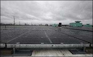 One of the automaker's biggest solar projects is a rooftop array at the GM Toledo Transmission Plant on Alexis Road that's expected to eventually generate 1.8 megawatts of electricity.