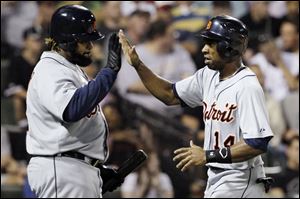 Detroit Tigers' Austin Jackson, right, celebrates with Prince Fielder after scoring on a single hit by Miguel Cabrera during the fifth inning Wednesday night.