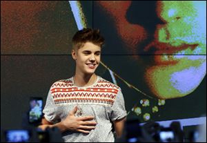 Justin Bieber, performs at an exclusive acoustic concert.