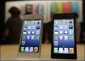 The new Apple iPhone 5 is displayed Wednesday Sfollowing the introduction of new products in San Francisco.  