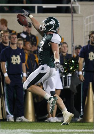 Michigan State's Charlie Gantt celebrates as he scores the game-winning touchdown in 2010.