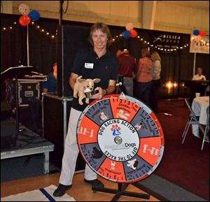 Ric Clark from Team Chihuahua in the Dog Race at the Dealin' for Dogs event to help the assistance dog program.