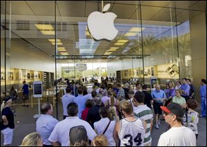 A line of customers enter an Apple store  in Scottsdale, Ariz. Delivery times climbed quickly as Apple Inc. started taking orders for the iPhone 5 on Friday. The iPhone 5 that Apple with only incremental changes seemed to signal that the industry has entered an era of technological bunny hops.