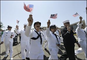 Sailors march in uniform during the gay pride parade in San Diego in July. 