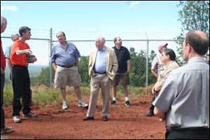 Jeffrey Hall, left, director of Lowell Observatory, briefs Neil Armstrong, center, about the Discovery Channel Telescope. Karen Bjorkman, dean of the college of natural sciences and mathematics at the University of Toledo, is at right.