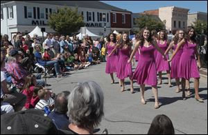 Perrysburg High School's Women's Select Show Choir performs at the Harrison Rally Day festival in downtown Perrysburg. Festival-goers also were treated to a fine art show Saturday.