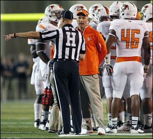 Bowling Green head coach Dave Clawson argues a call with an official Saturday at the Glass Bowl In Toledo. BG was able to overcome a 352-yard passing day in beating Idaho, but wasn't able to endure a 322-yard passing day by Toledo and suffered a 27-15 loss to the Rockets.