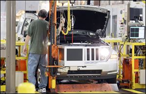 Toledo-area Chrysler dealers say they were impressed by the announcement show put on by the company in Las Vegas. The manufacturer announced its plans for the replacement of the Jeep Liberty, seen here being made in Toledo, at the show but what was revealed in Vegas stayed in Vegas.