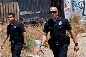 This film image released by Open Road Films shows Michael Pena, left, and Jake Gyllenhaal in a scene from 