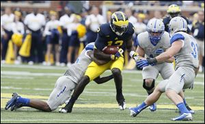 University of Michigan's Devin Gardner leads the Wolverines receiving attack with eight catches for 155 yards and 3 touchdowns this season.
