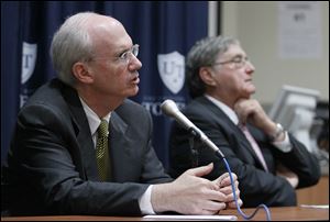 Dr. Jeff Gold, Chancellor and executive vice-president for biosciences and health affairs and dean of the College of Medicine and Life Sciences, speaks as UT president Dr. Lloyd Jacobs listens at a town hall forum Friday at the University of Toledo Medical Center.