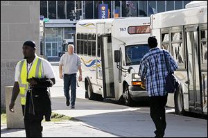TARTA buses line up at Erie and Madison in downtown Toledo. Rossford will now be the community nearest to Perrysburg with continuing TARTA service.
