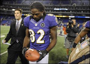 Baltimore Ravens wide receiver Torrey Smith walks off the field after an NFL football game against the New England Patriots in Baltimore on Sunday.