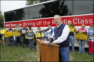 Former Ohio governor Ted Strickland speaks Tuesday during a rally at UAW Local 14, 5411 Jackman Road.