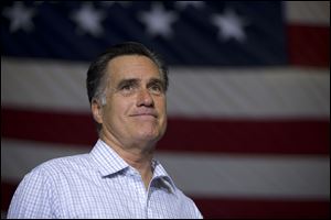 Republican presidential candidate, former Massachusetts Gov. Mitt Romney pauses during a campaign rally in Westerville, Ohio.